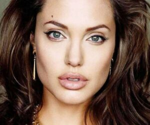 Angelina Jolie posing with her mole next to her eyebrow
